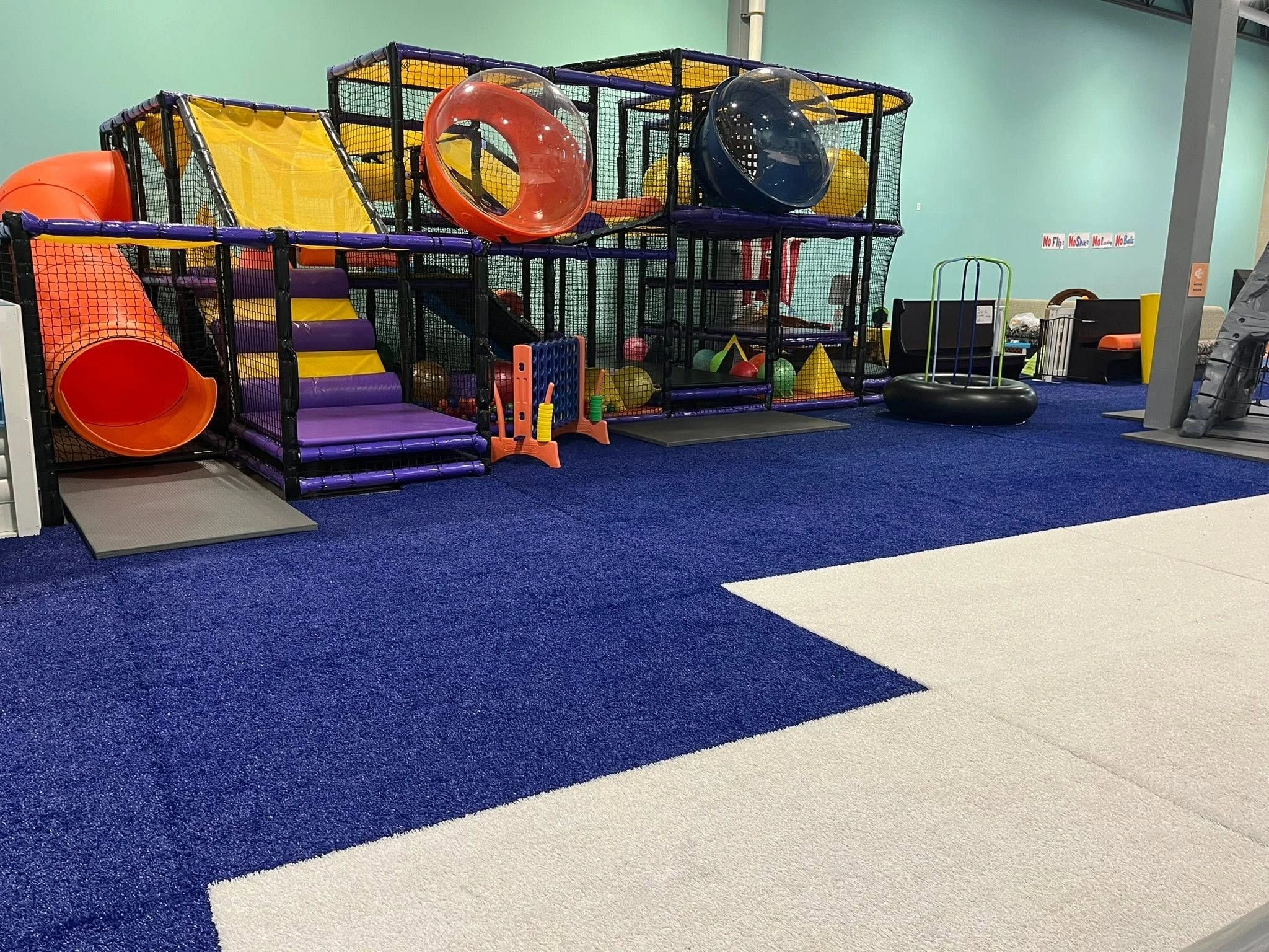 Kids playing on indoor climbing structure at Wisco Kidz Place